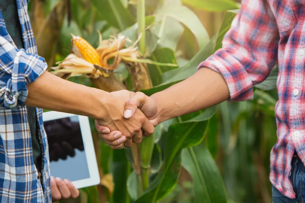 Farmers making a handshake agreement 