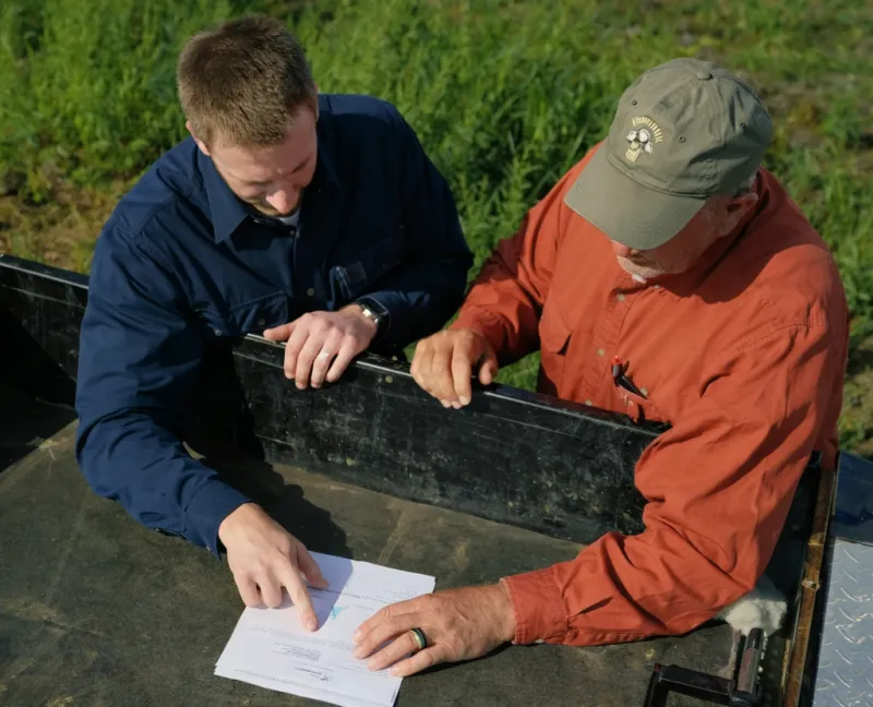 Two farmers discussing plans