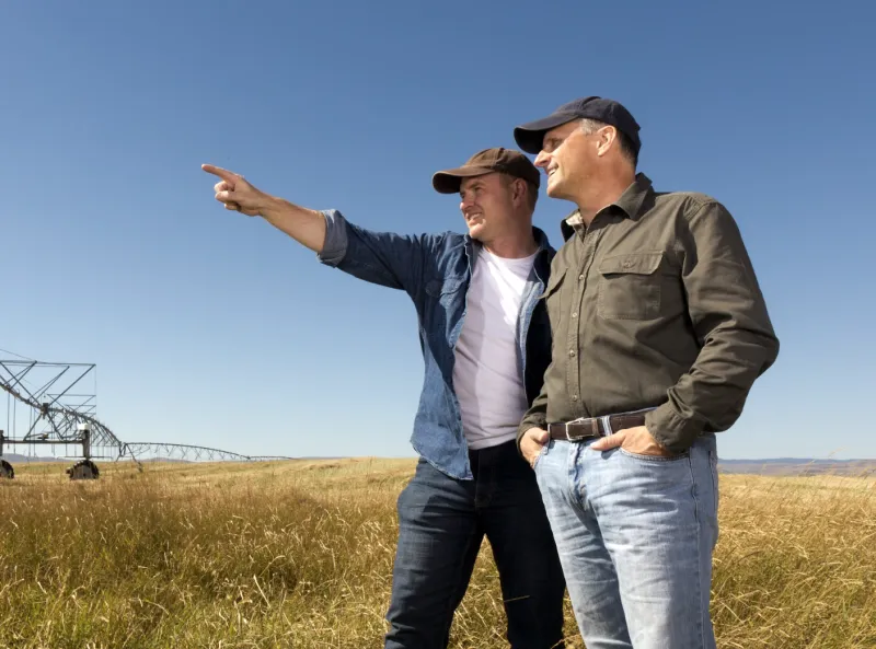 Farmers surveying their land. 