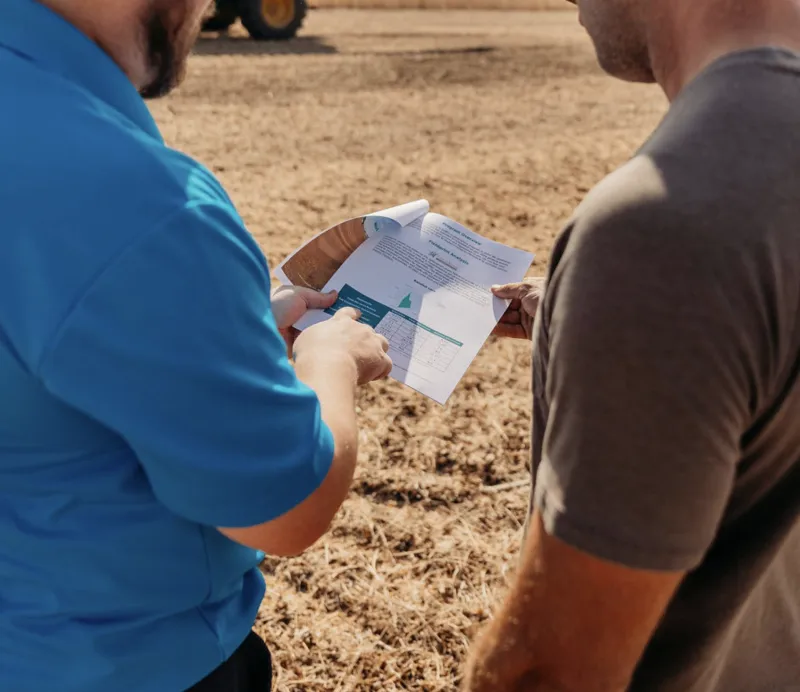 Farmers viewing a report 