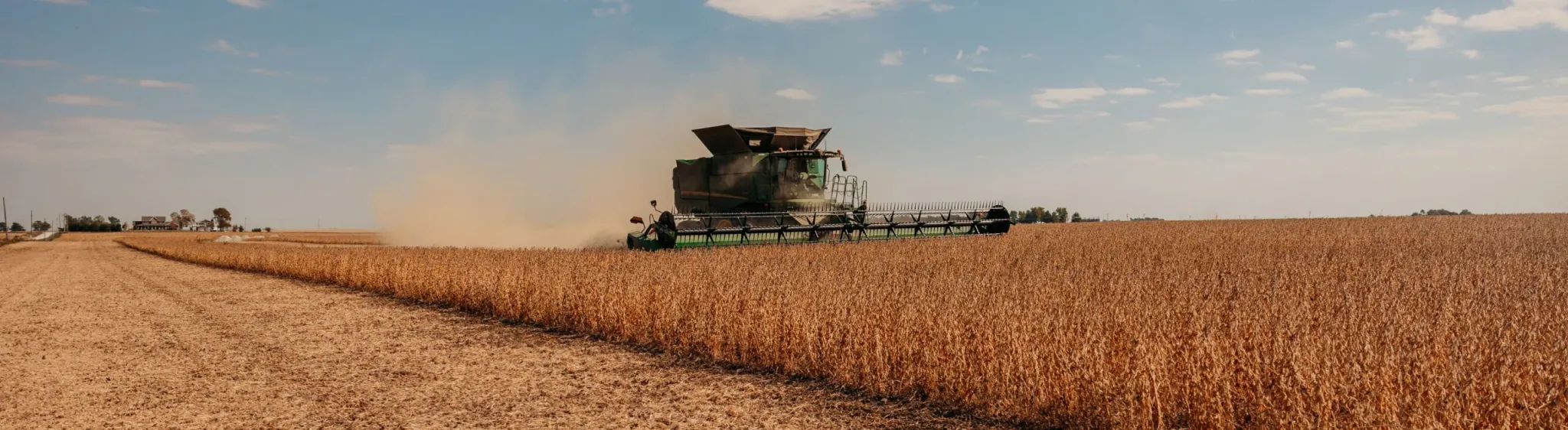 Large farming tractor in a field. 