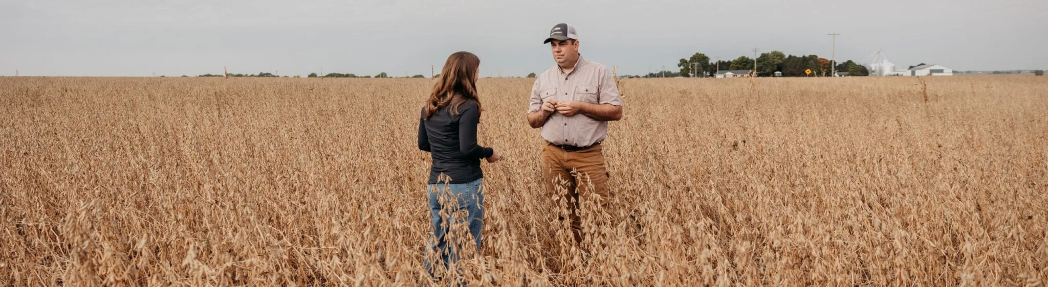 Farmers standing in a field. 